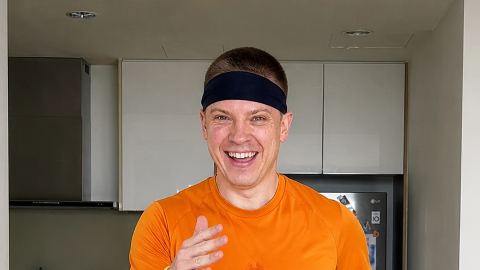 Dopamine Steps host doing a grounded standing cardio heel tap