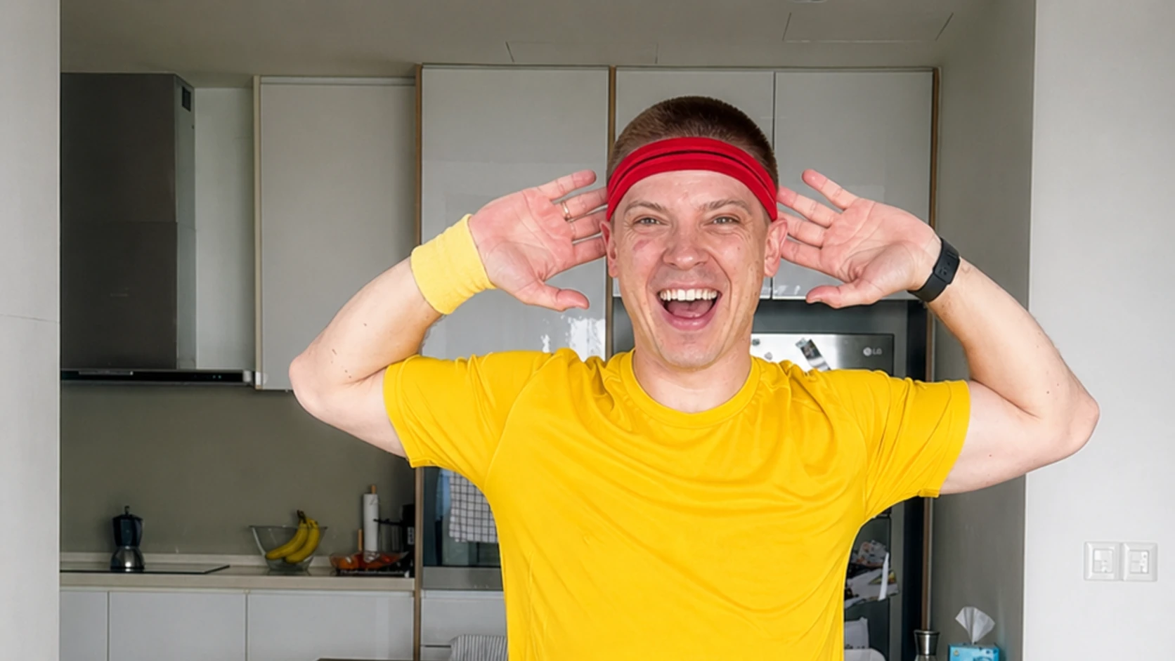 Dopamine Steps host opening their arms during a small-room workout
